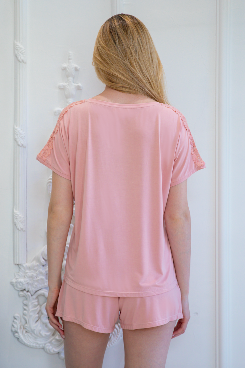 Back view of stylish pink pajama set with lace accents from a top sleepwear factory, crafted by expert pajamas manufacturers.