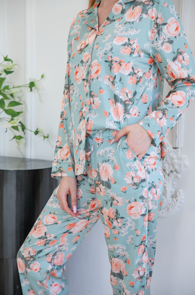 A detailed shot of a high-quality floral satin sleepwear set, demonstrating the fine craftsmanship of top pajamas manufacturers