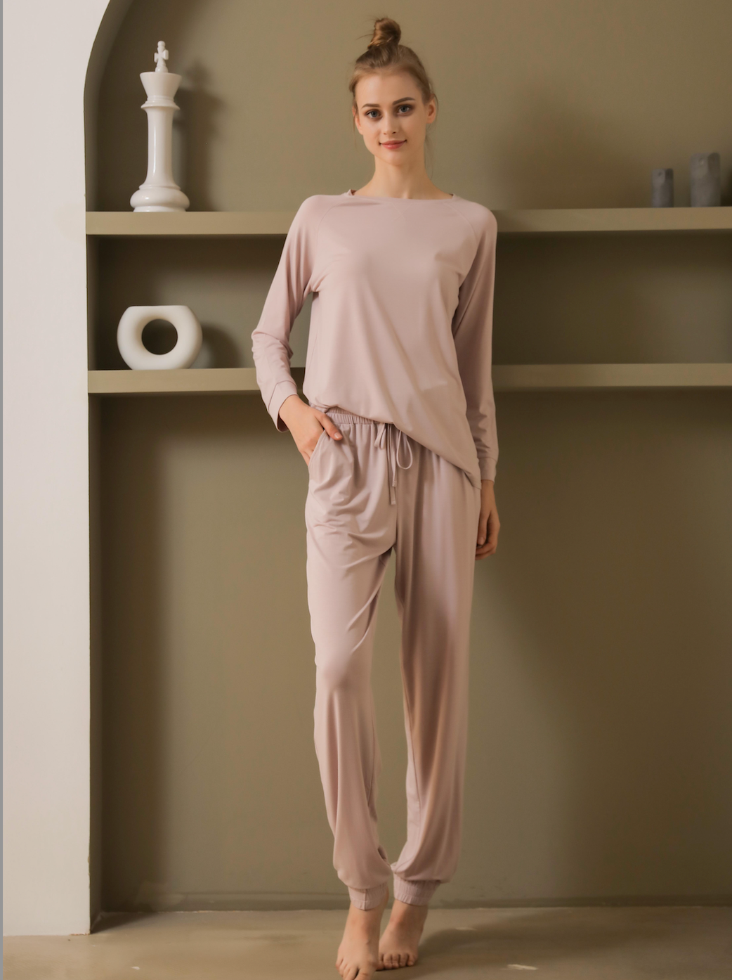 Cozy modal long sleeve and long pants set from a leading pajama manufacturer, featuring a pink top with pockets and matching drawstring pants, perfect for a comfortable and stylish sleepwear option. Crafted by a renowned sleepwear factory