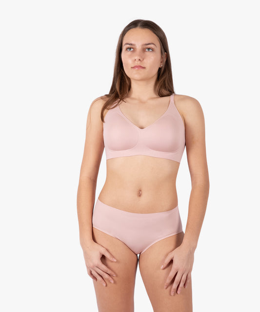 Soft pink seamless bra from a top underwear factory, crafted by a leading sleepwear factory or pajamas manufacturers for a comfortable and sleek fit.