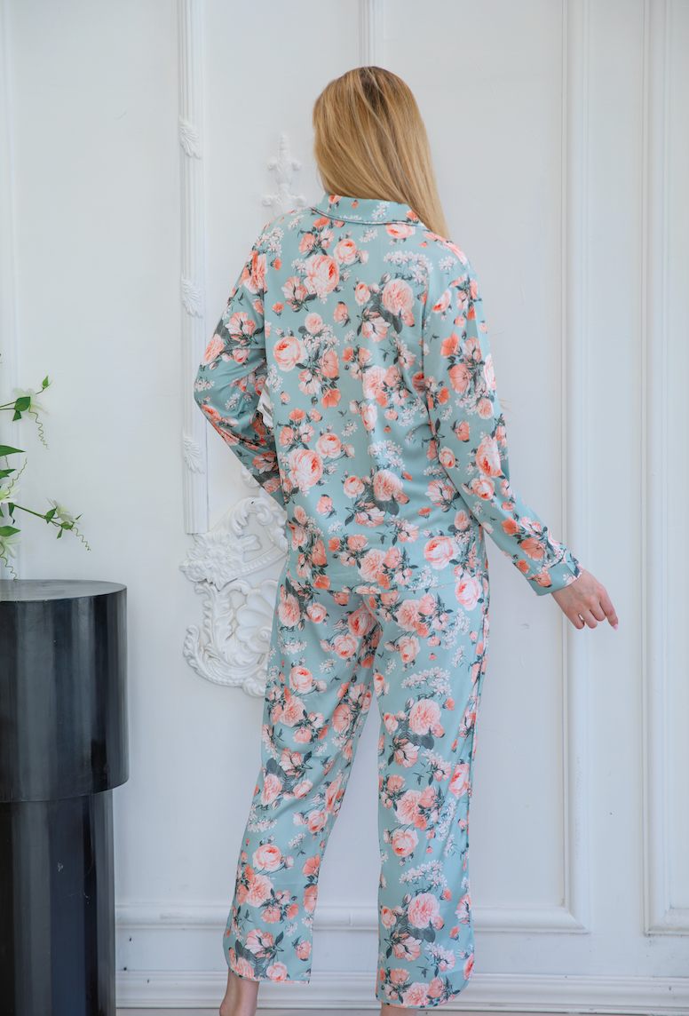 A model wearing a beautiful floral print pajama set, a product example from a reliable pajamas manufacturer